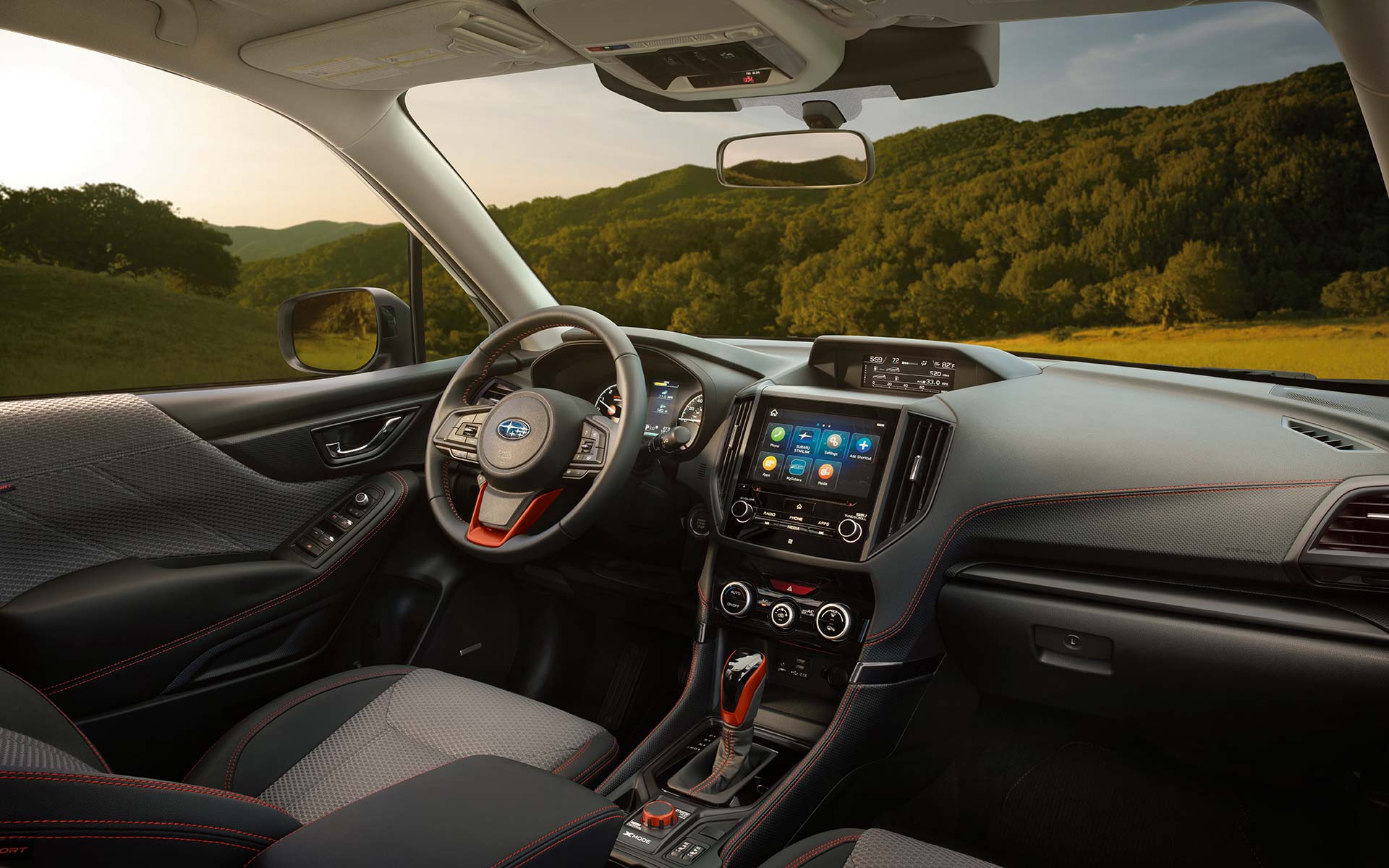 The interior and front dash of the 2022 Forester Sport.