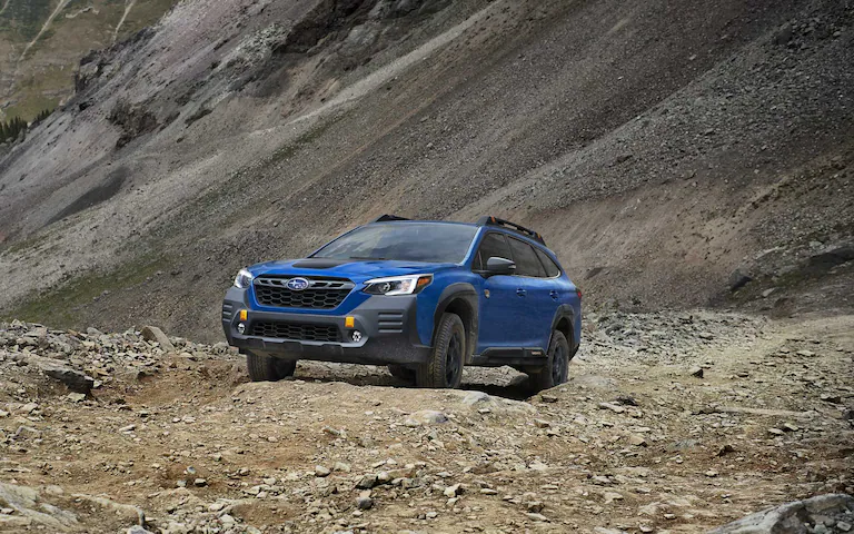 A close-up of the wheels of the 2022 Outback Wilderness showing the 9.5 inches of ground clearance.